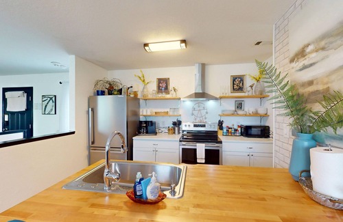 Piney House | Stylish duplex with lakefront views, modern design, and spacious interiors