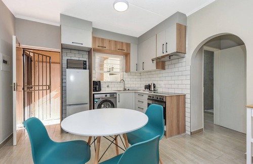 Sandown Apartment | Stylish Garden Retreat w/Pool and Modern Amenities