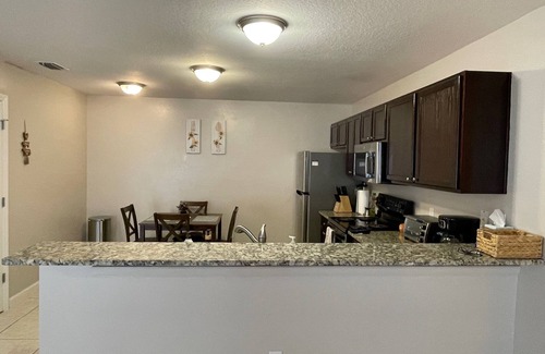 Duval House | Stylish Home in Duval w/Granite, Tile Floors, Glass Lanai & Gas Golf Cart!