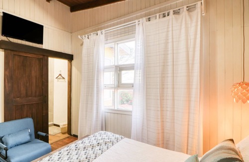 La Cruz House | Stylish hotel suite in family hotel with bay views, fast WiFi, & restaurant