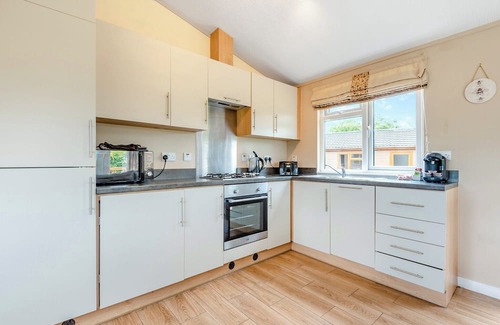 Halfway House Ski Chalet | Stylish luxury lodge with hill view.