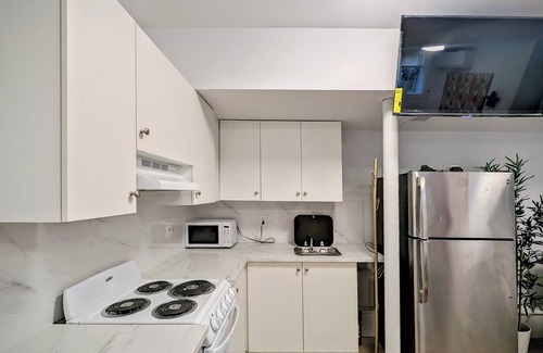 Queens Apartment | Stylish Studio Apartment on Main Street with Courtyard and Free Parking!