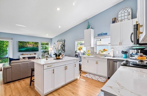 Tropic Palms House | Stylish Tropical Heated Pool Home, Large Deck, Pool Table, Pac-Man, Games