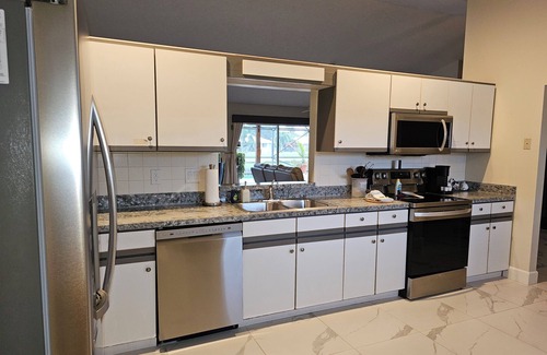 Port Saint Lucie House | Stylish Waterfront Home w/Heated Pool, 8 miles to the Beach, Close to Shopping.