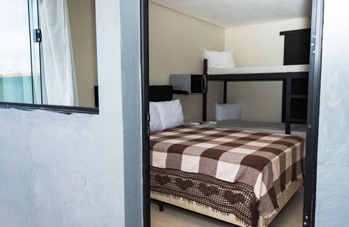 Jardim Aruan Bed & Breakfast | Suíte Familiar Praia Indaiá - 03 Caraguatatuba