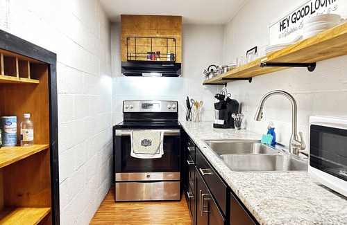 Blair Heights Apartment | "SUITE LINDA" walk-out suite in a park setting