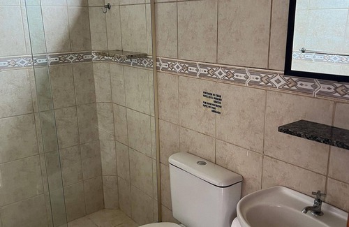 Garopaba House | Suite Térrea Premium - Pousada Buena Onda - SC