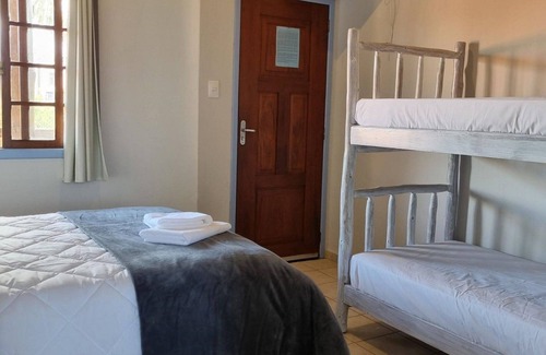 Garopaba House | Suite Térrea Premium - Pousada Buena Onda - SC