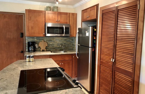 Kihei Condo | Summer DEALS! Partial Ocean View Condo with pool - just steps from the beach.