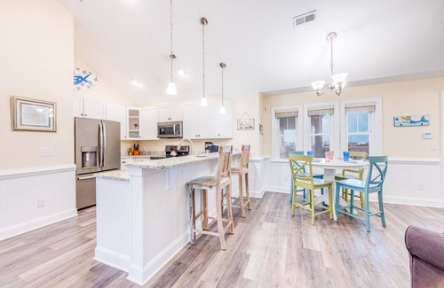 Hatteras Condo | SUMMER SAVINGS - Canalfront Condo w/Private Deck, Resort Pool, and Boat Slips