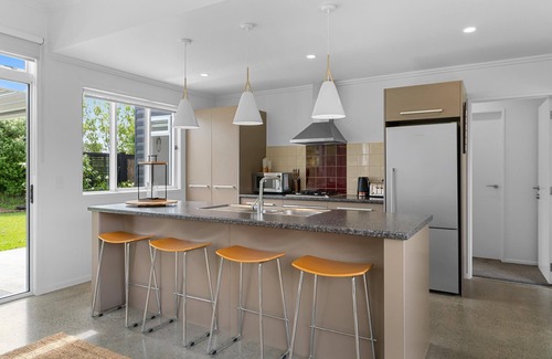 Mangawhai House | Sun Central - Modern, sunny holiday home in tranquil garden setting