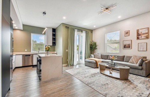 Historic Old Northeast Apartment | Sun Soaked Designer Condo with Patio
