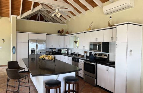 Estate Concordia East House | Sunflower - Amazing view of the Caribbean Sea, pool & lush tropical landscaping
