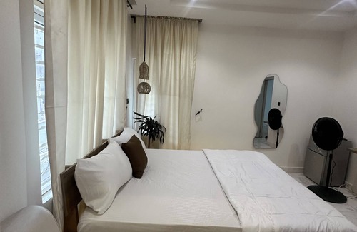 Abuja Apartment | Sunflower themed room in very serene and secure environment in the city center.