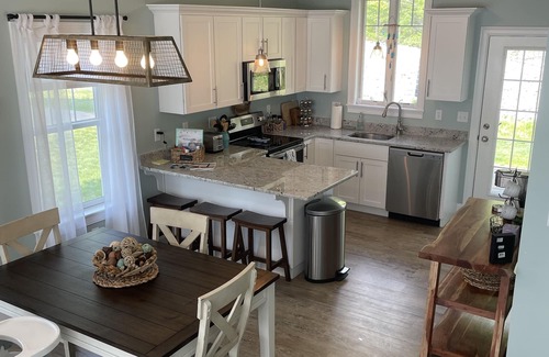 Arundel Cottage | Sunkissed cottage, resort amenities, heated pools, club house, close to beaches
