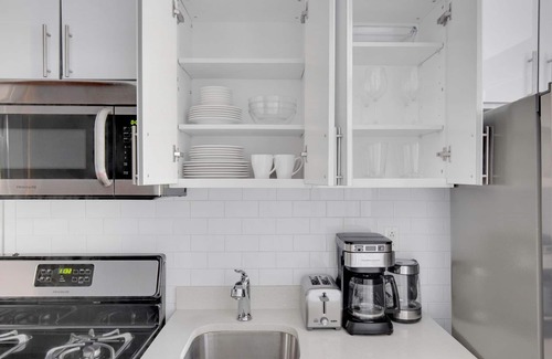 Chinatown Apartment | Sunlit LES 1BR w/W/D, steps to B/D train, by Blueground