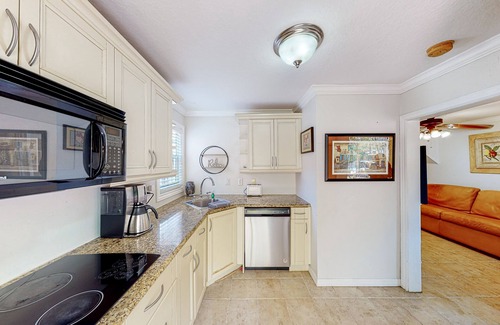 Riviera Beach Apartment | Sunny abode with shared pool & grill access - well-equipped kitchen, AC, and W/D