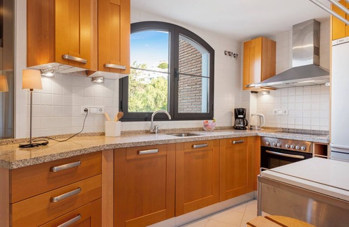 Benahavis Apartment | Sunny balcony with pool by Costarentals - Ref M52