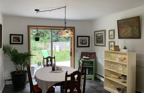 Waddington House | Sunny bedroom with full bed and private bathroom.
