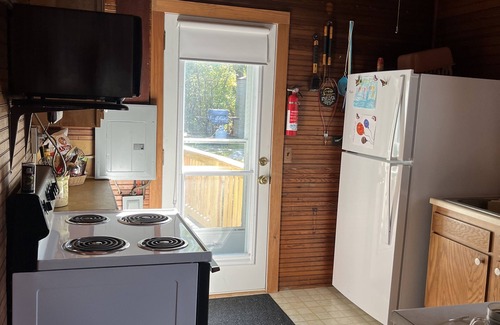 Fishers Landing Cottage | Sunny cottage built over the water on the St. Lawrence River