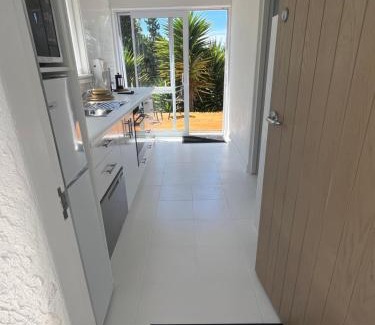 Nelson Apartment | Sunny hillside central Nelson hideaway with city to sea views