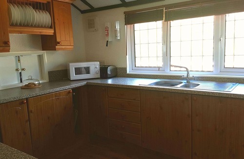 Brayford Cabin | Sunset Cabin, watch the sunset over the north Devon horizon in this cosy cabin!