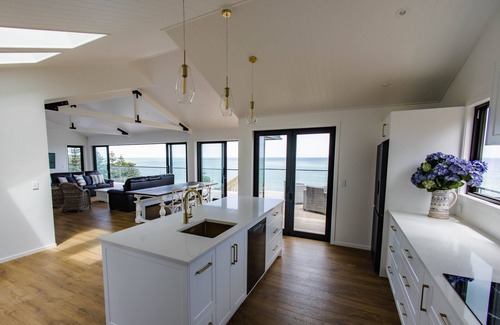 Kai Iwi House | Sunset Delight. Beautiful home with expansive sea views.