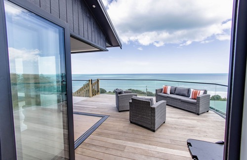 Kai Iwi House | Sunset Delight. Beautiful home with expansive sea views.