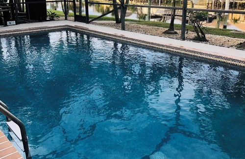 Punta Gorda House | Sunset lit sky over private pool lanai! Walk 2 town & all around! PRIME LOCATION