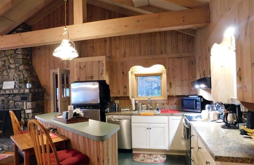 Naples Cottage | Sunset point waterfront home on with lots of outdoor space! Pet-friendly!
