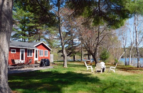Naples Cottage | Sunset point waterfront home on with lots of outdoor space! Pet-friendly!