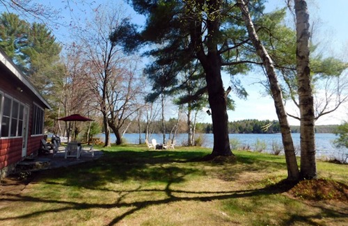 Naples Cottage | Sunset point waterfront home on with lots of outdoor space! Pet-friendly!