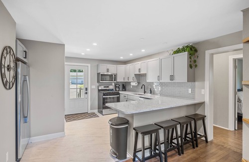 La Porte House | Sunset Shores - Lakefront Home with Hot Tub and Fire Pit