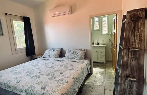 Sandy Bay Hotel | Sunset View Condo @ The Blue Bahia Resort in Sandy Bay