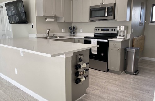 Florida Ridge Condo | Sunsets and Tennis Views! Totally remodeled condo with private deck