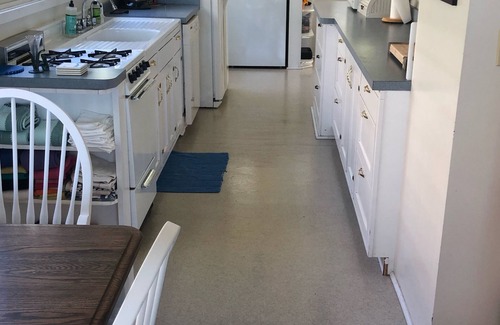 Alden Cottage | Sunsets & Private Sandy Beach Cottage on Torch Lake in Alden
