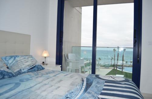 Punta Prima Apartment | Super zeezicht in eerste lijn met verwarmd zwembad en fitness