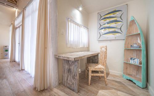 East Sumba House | Surfer - Single Room Bungalow with Queen Bed, Working Desk, Shower, FREE Access to Pool and Gym, Onsite SPA, Car-Bike-ATV Rental, Diving and Fishing