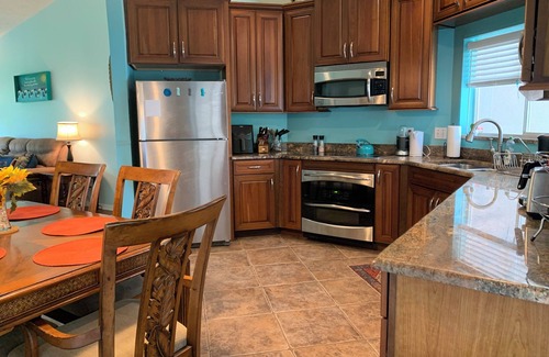 Floridana Beach House | Surfing Buddha Family Beach House - walk to beach - pet friendly