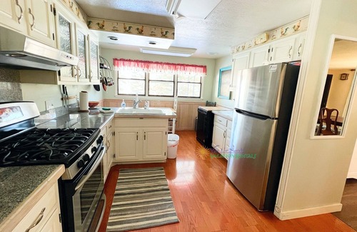 Suttons Bay House | Suttons Bay farmhouse-style home. 5 bedrooms. Air conditioning. Pet okay