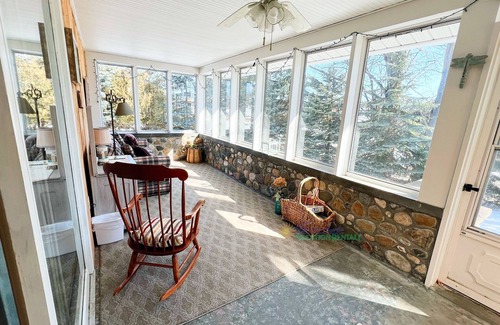 Suttons Bay House | Suttons Bay farmhouse-style home. 5 bedrooms. Air conditioning. Pet okay