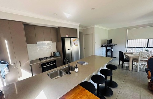 Austral House | Sydney's Leading 5 Bedroom home with AC, TVs and Study - Home away from home