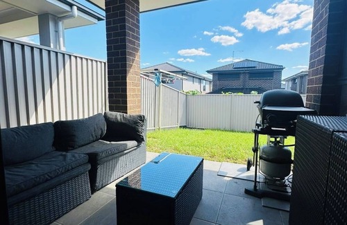 Austral House | Sydney's Leading 5 Bedroom home with AC, TVs and Study - Home away from home