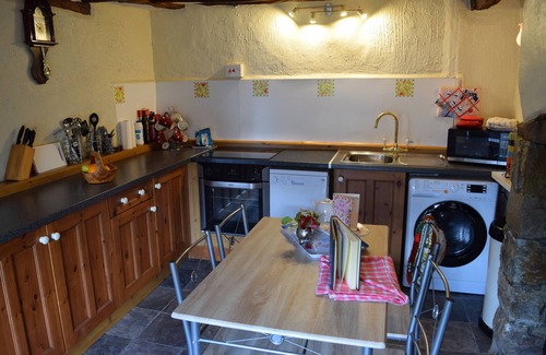 Marhamchurch Cottage | tea cosy cottage mid terrace cob house pub 500 meters beach 3 miles.