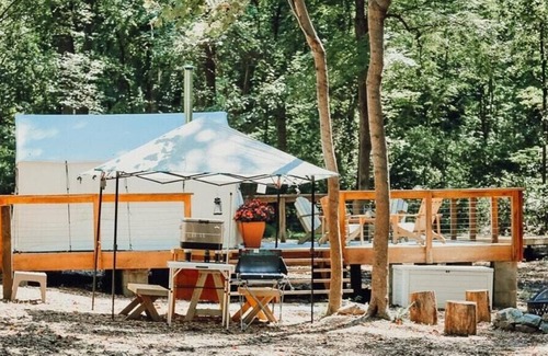 Carrolltowne RV Rental | Tentrr Signature Site - Fern Creek at Azimuth Acres - Coleman Cooking Site
