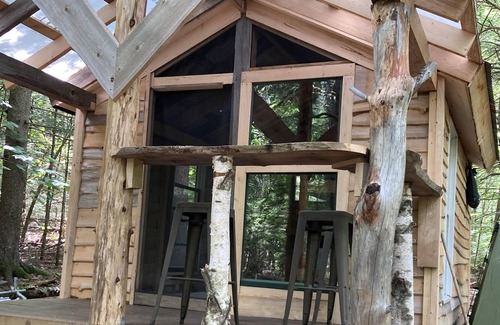 Freedom RV Rental | Tentrr Signature Site - Ohana Roots Camp at Sandy Pond, Forest Hideaway Site