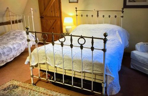 Cheveley House | Thatched Cottage - with dog Poppy