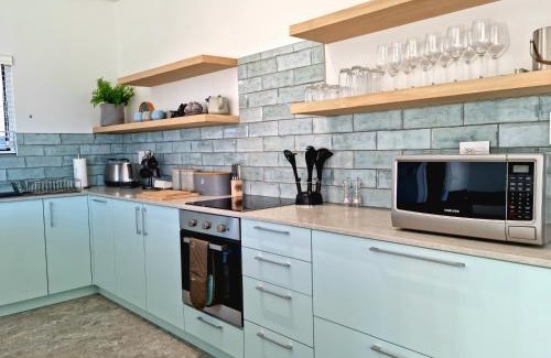 Gordons Bay Central Apartment | The Anchor, Luxury living for 2 with sea view and Jacuzzi