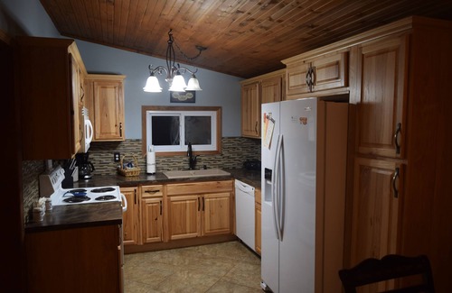 Traverse City House | The Bass Lake Lodge - Traverse City's year-round slice of lake life Heaven!