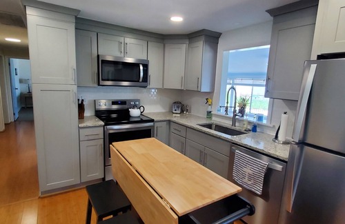 Mount Holly House | The Beach Retreat is a cozy beach Villa with Hottub overlooking a private beach.